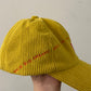 BIG PLANS: Yellow corduroy baseball cap