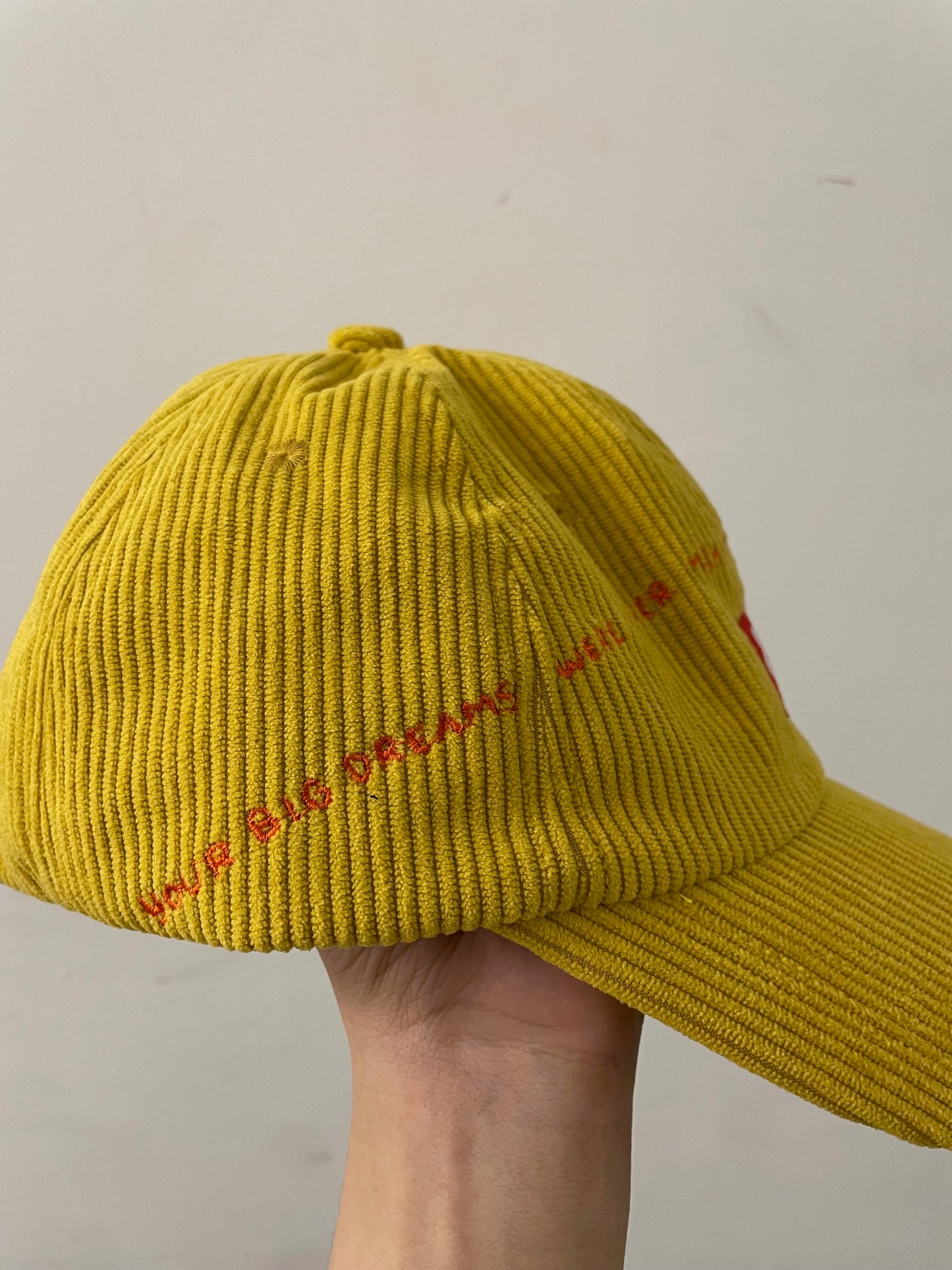 BIG PLANS: Yellow corduroy baseball cap